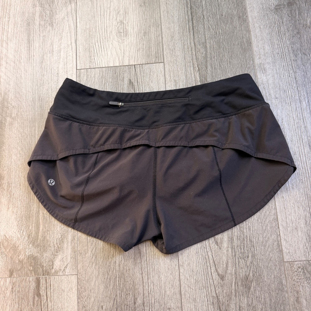 Lululemon Speed Shorts Size 6 Black Zip Pocket Liner Running Athletic Tulip Hem